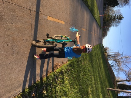 Bicycling home with a dandelion in her back pocket3